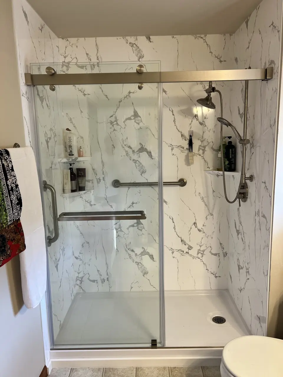 Light marble tub-to-shower conversion